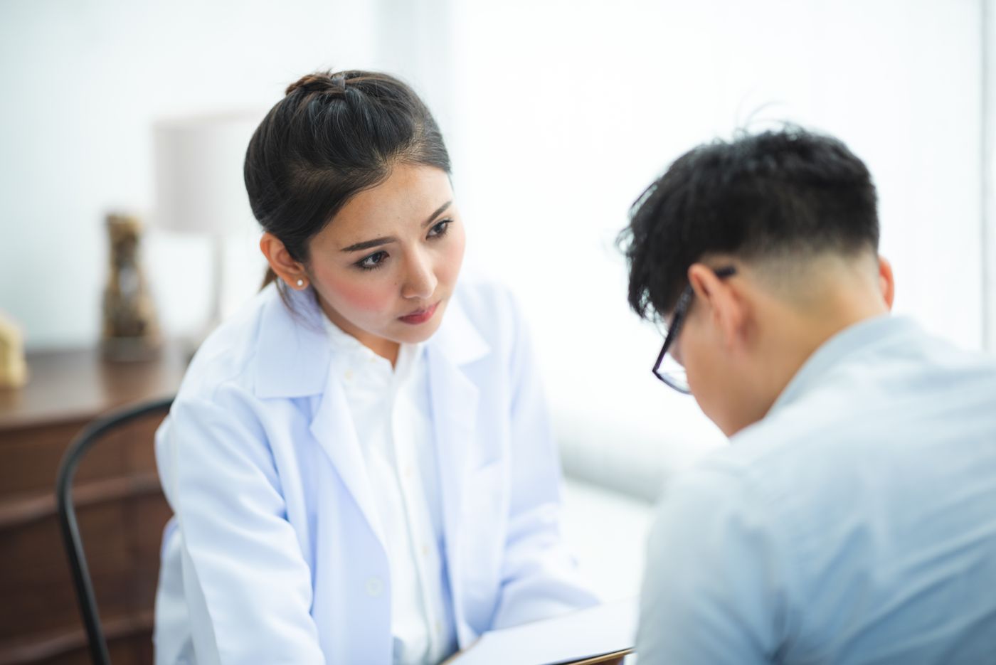 A Chinese doctor listening to a patient
