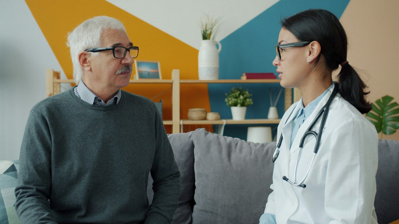 A Chinese doctor talking with an international patient