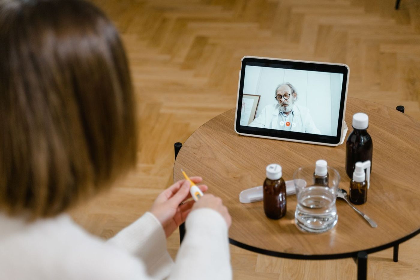 A patient at home on a video call with a doctor